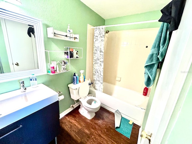 full bathroom with toilet, hardwood / wood-style flooring, vanity, and shower / bathtub combination with curtain