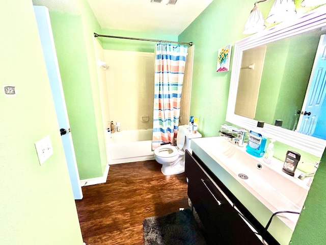 full bathroom with vanity, wood-type flooring, toilet, and shower / bathtub combination with curtain