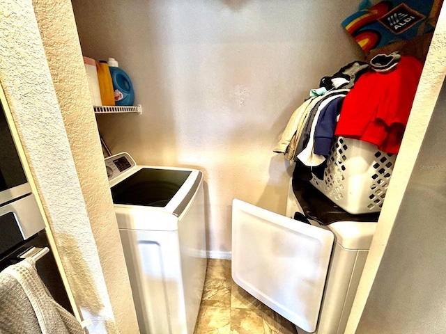 washroom with separate washer and dryer