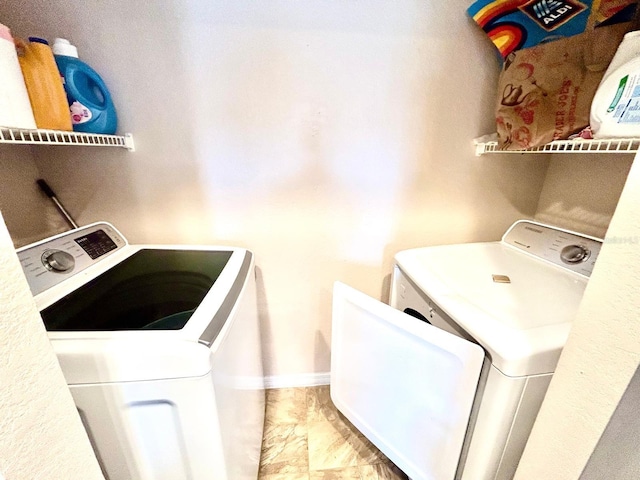 laundry room featuring washer and clothes dryer