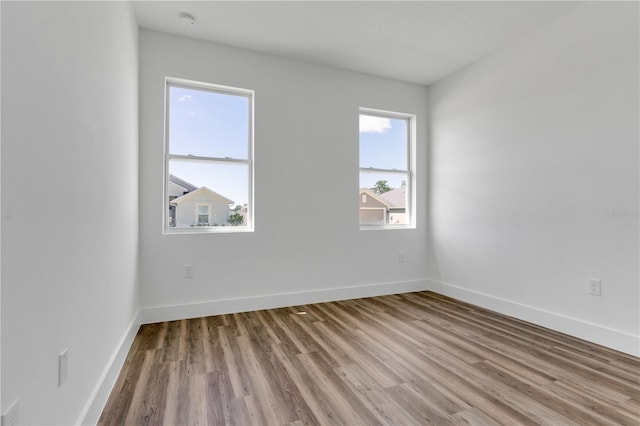 unfurnished room featuring light wood-type flooring