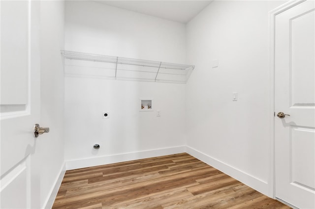 laundry room with hookup for an electric dryer, wood-type flooring, and hookup for a washing machine