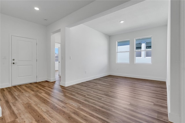 spare room with light wood-type flooring