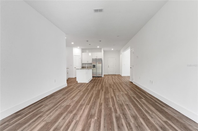 unfurnished living room featuring hardwood / wood-style floors