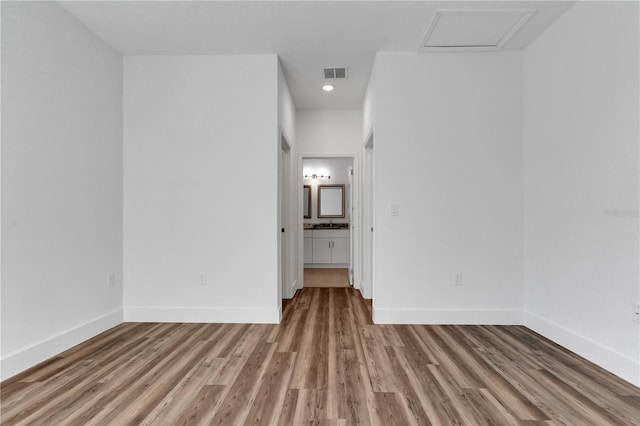 spare room featuring light hardwood / wood-style flooring