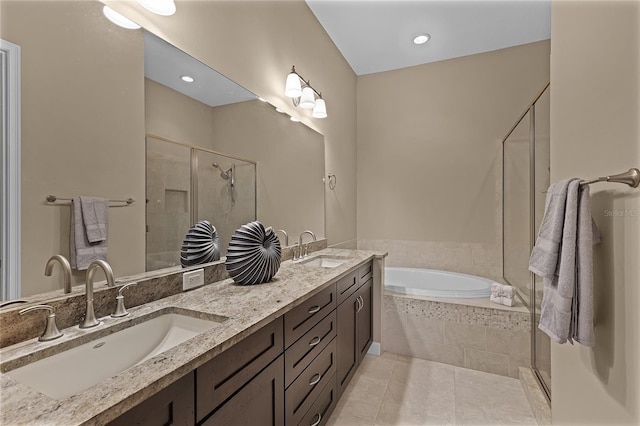 bathroom featuring vanity, independent shower and bath, and tile patterned flooring