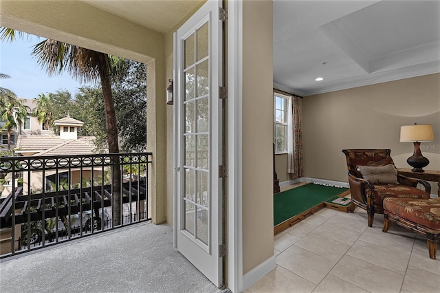 interior space with crown molding and light tile patterned floors