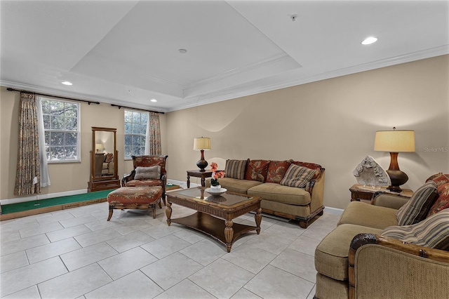 living room featuring crown molding, a tray ceiling, and light tile patterned floors