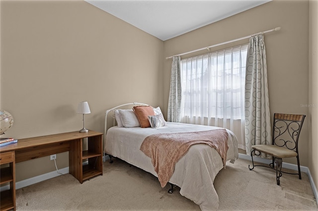 bedroom featuring light colored carpet