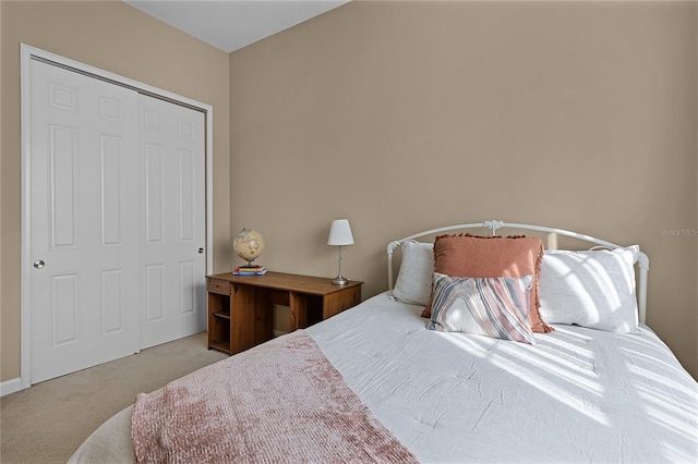 carpeted bedroom with a closet