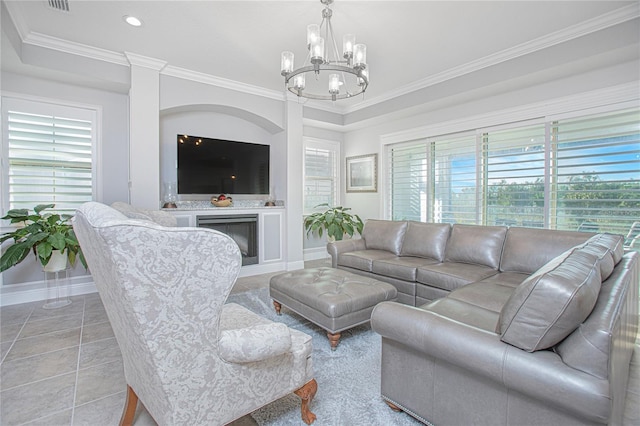 tiled living room with a wealth of natural light, crown molding, and a chandelier