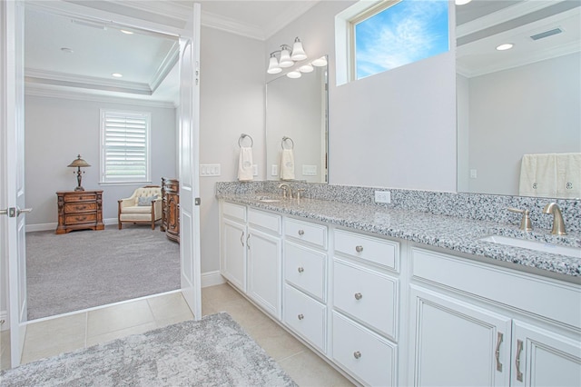 bathroom featuring vanity, crown molding, and tile patterned flooring