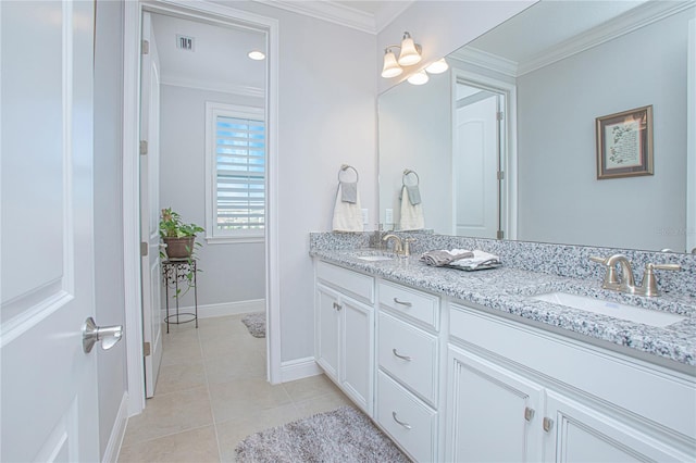 bathroom featuring vanity, ornamental molding, and tile patterned floors