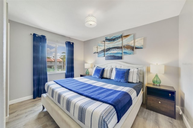 bedroom with light wood-type flooring