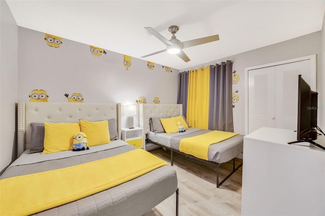 bedroom with a closet, ceiling fan, and light wood-type flooring