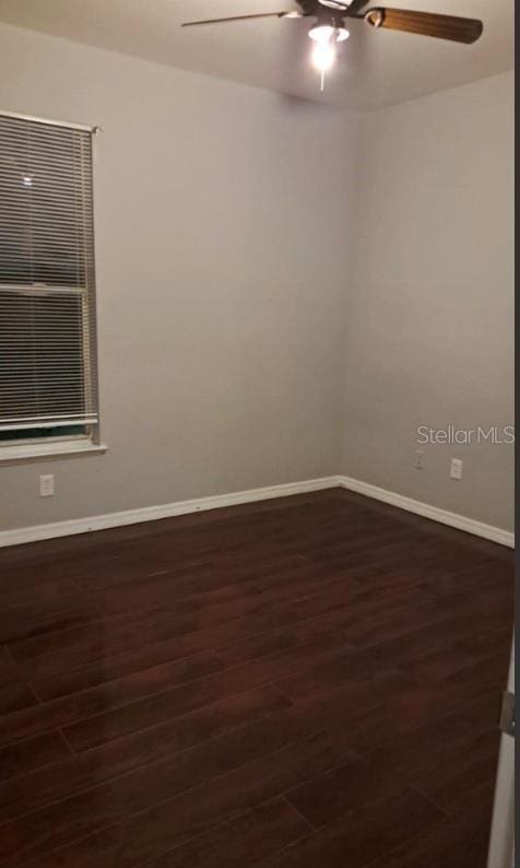 unfurnished room with dark hardwood / wood-style floors