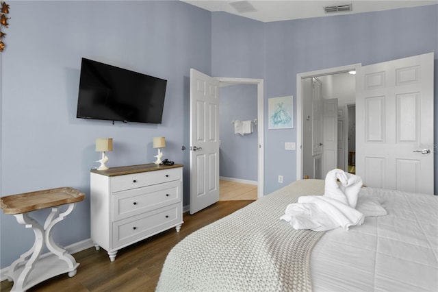 bedroom featuring dark hardwood / wood-style flooring