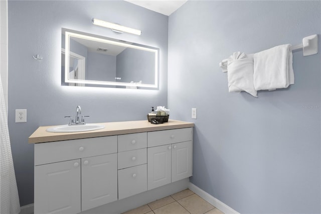 bathroom featuring vanity and tile patterned flooring