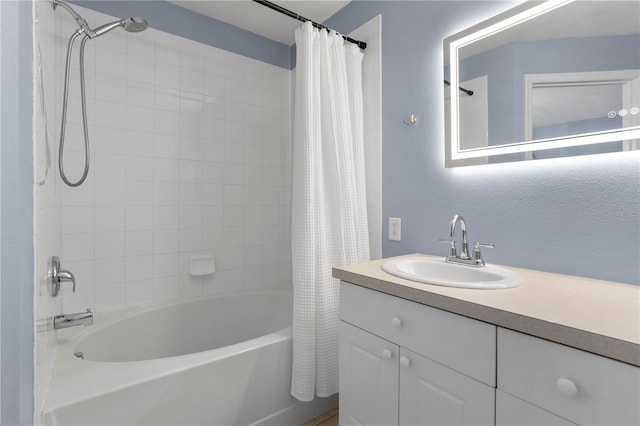 full bathroom featuring vanity and shower / bathtub combination with curtain