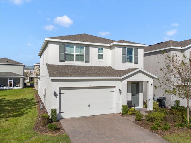 view of front facade featuring a front lawn and a garage