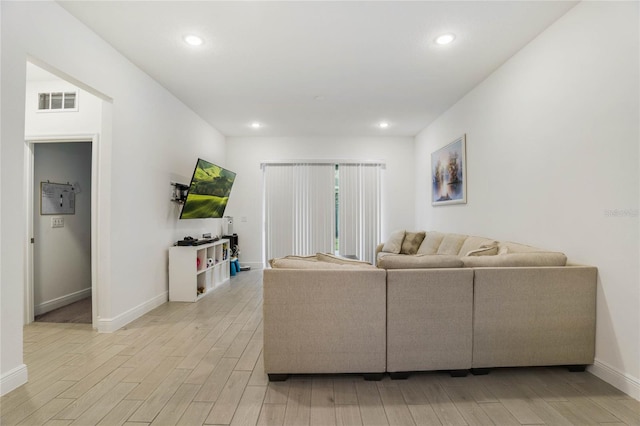 living room with light hardwood / wood-style flooring