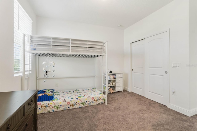 carpeted bedroom featuring a closet