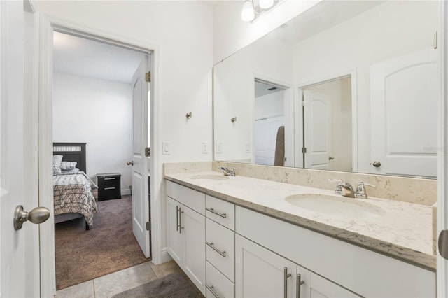 bathroom with tile patterned floors and vanity