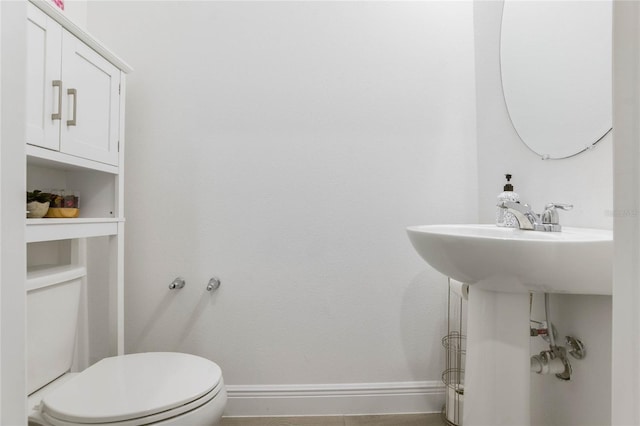 bathroom with tile patterned floors and toilet