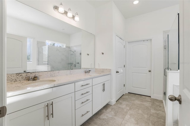 bathroom with vanity, tile patterned floors, and an enclosed shower