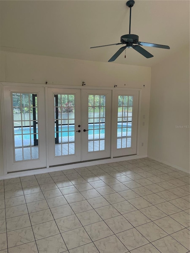 tiled spare room with french doors, ceiling fan, and a wealth of natural light