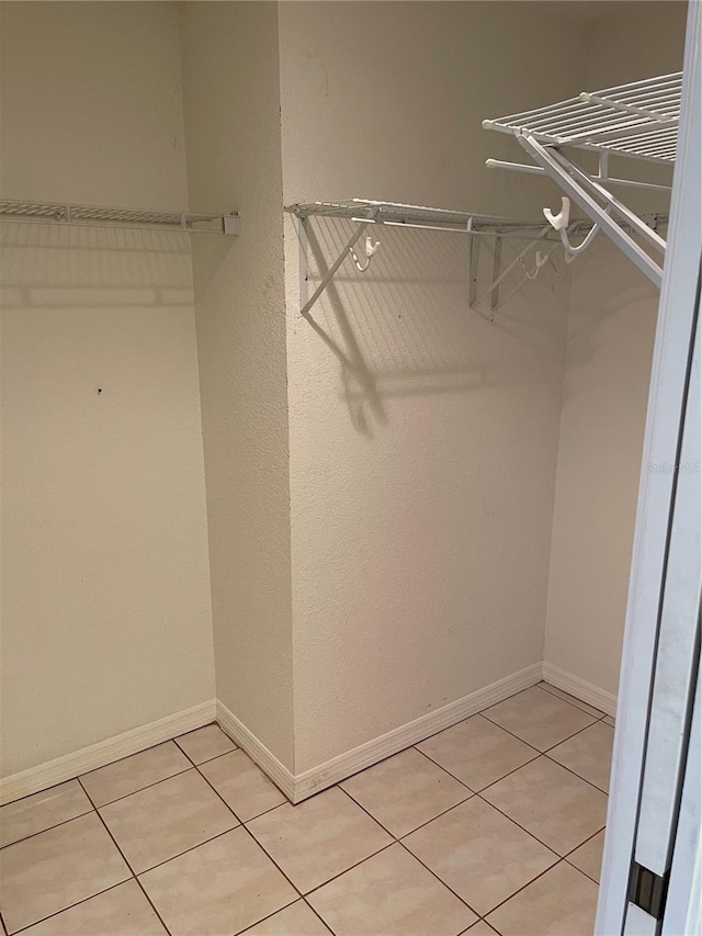 walk in closet featuring light tile patterned floors