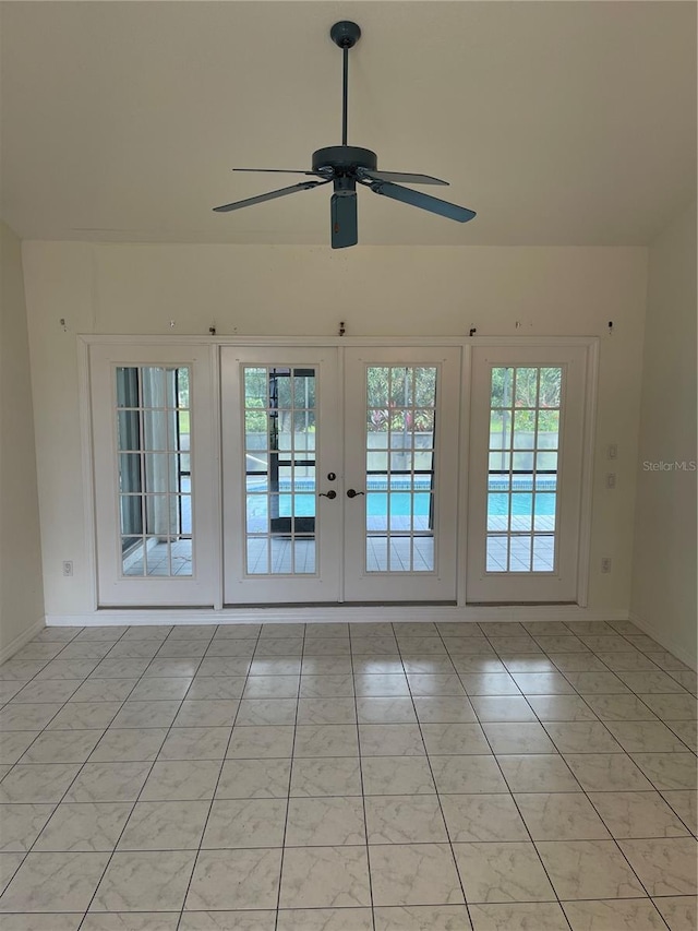 unfurnished room featuring french doors, ceiling fan, and light tile patterned floors