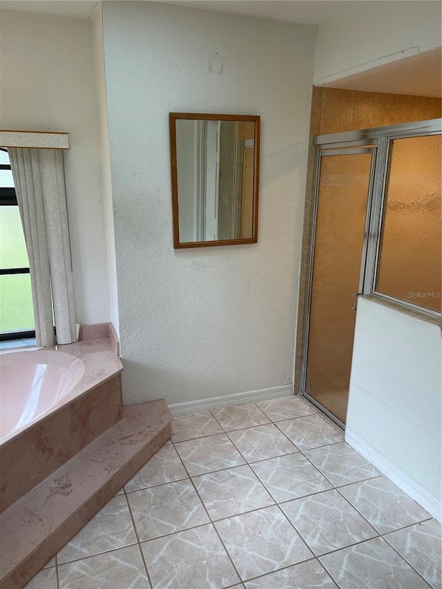 bathroom featuring separate shower and tub and tile patterned flooring