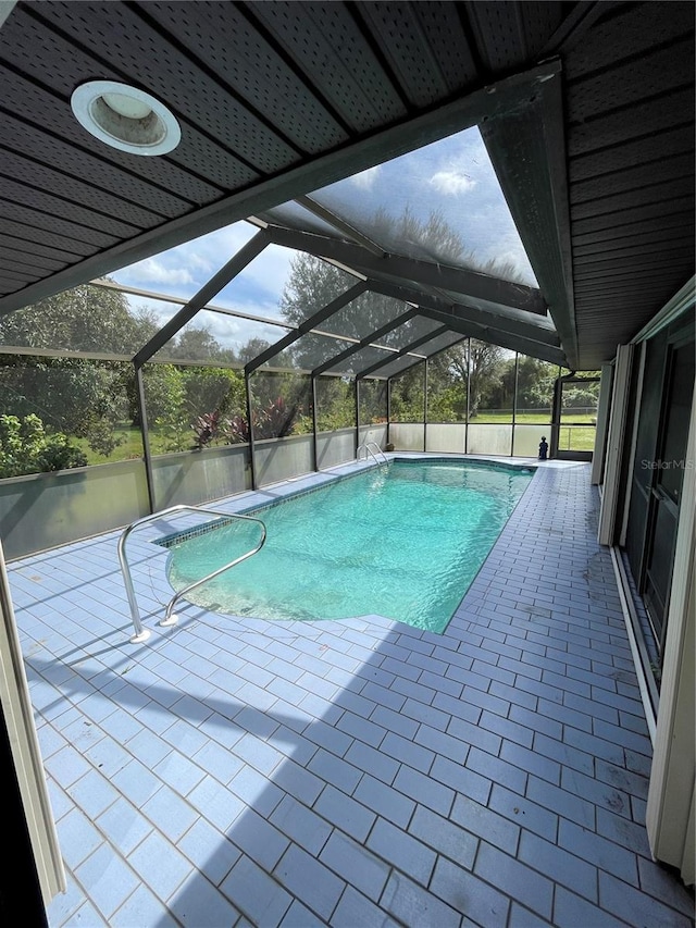 view of pool featuring a patio and a lanai