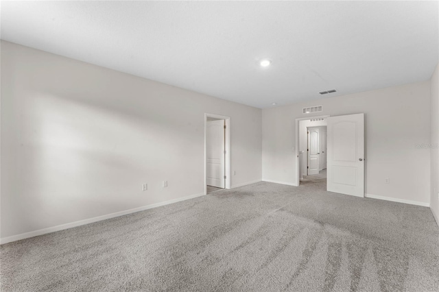 empty room with light colored carpet