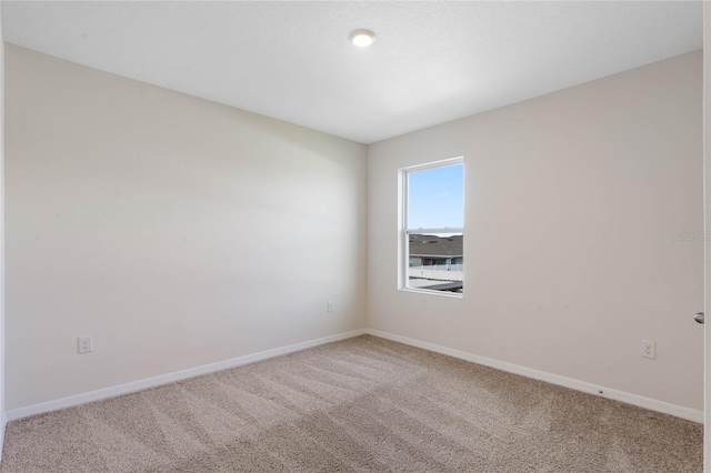 unfurnished room featuring carpet floors