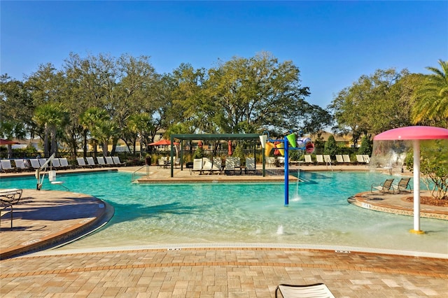 view of pool with pool water feature