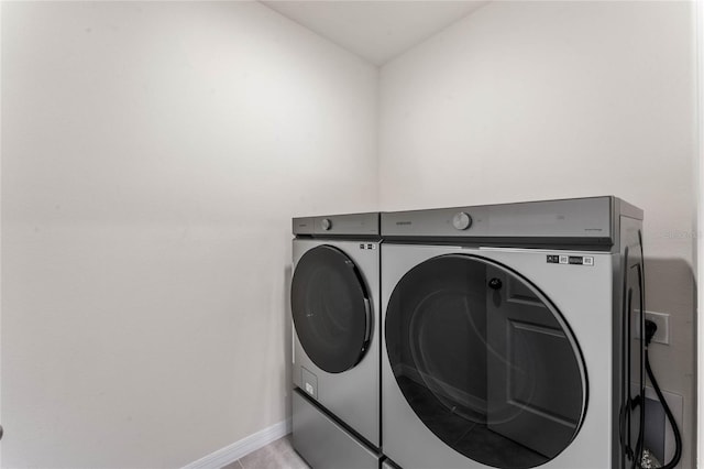 laundry area featuring washing machine and clothes dryer