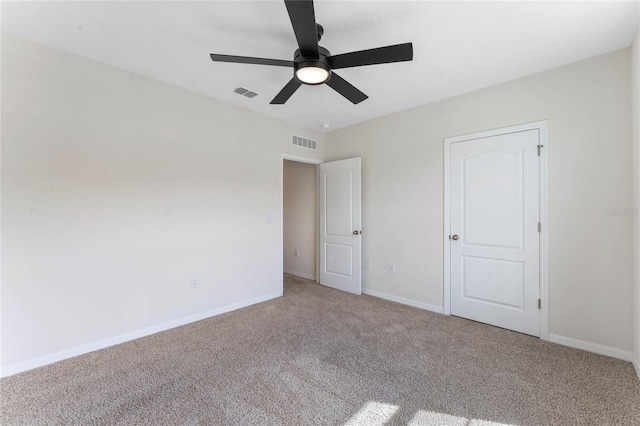 unfurnished bedroom with ceiling fan and carpet flooring