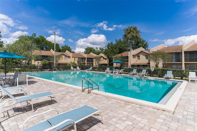 view of swimming pool with a patio