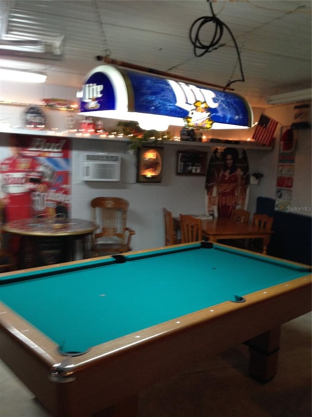 recreation room featuring an AC wall unit and billiards