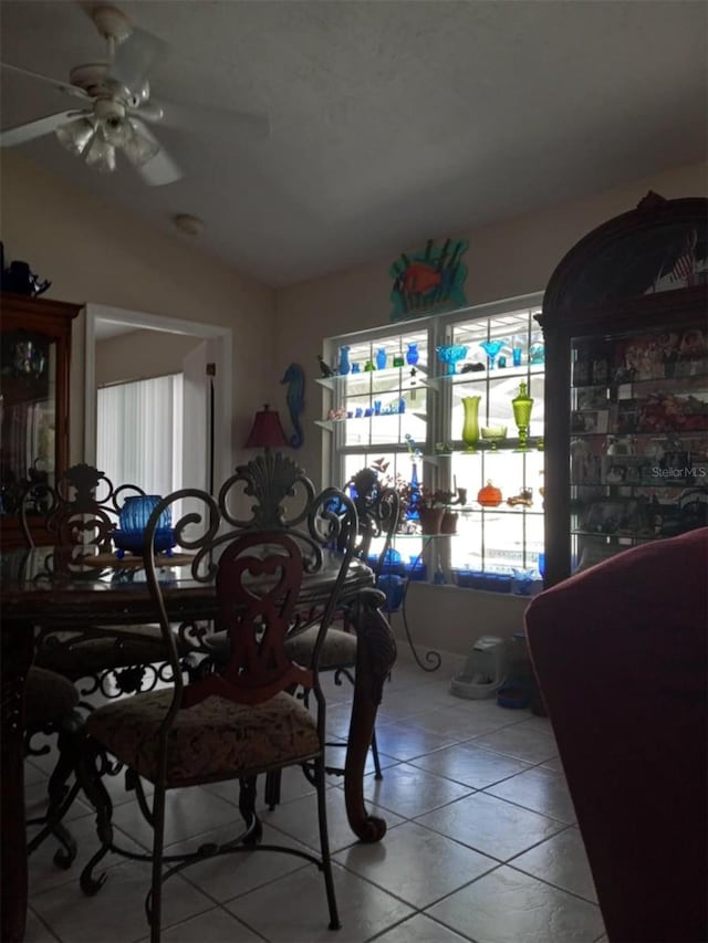 tiled dining room with ceiling fan