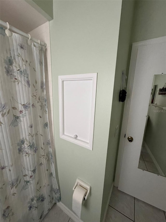 bathroom featuring a shower with curtain and tile patterned floors