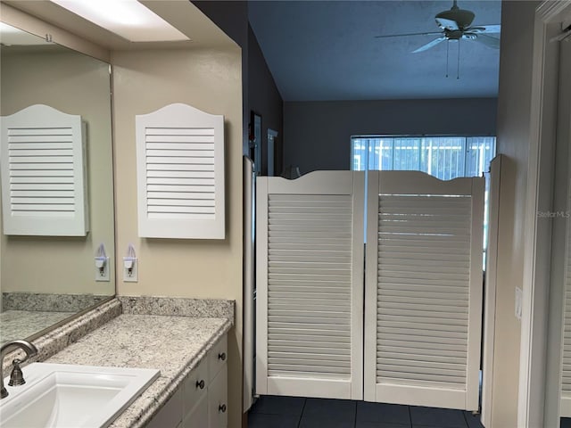 bathroom featuring vanity, tile patterned floors, and ceiling fan