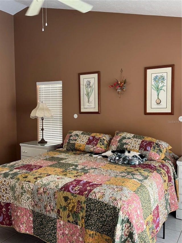 bedroom with tile patterned flooring and ceiling fan