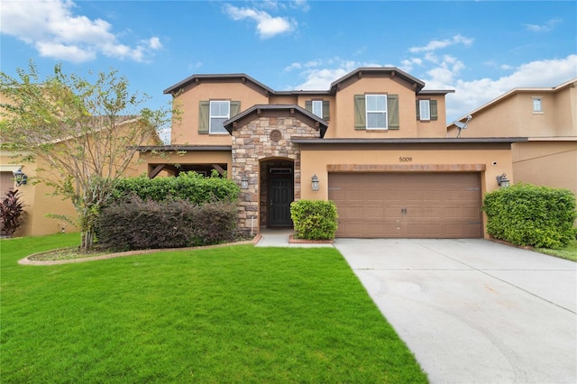 view of front of property featuring a front yard and a garage