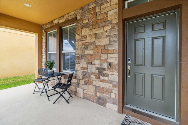 property entrance featuring covered porch