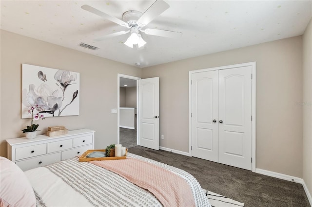 carpeted bedroom with a closet and ceiling fan