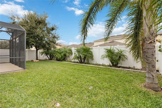 view of yard with a lanai