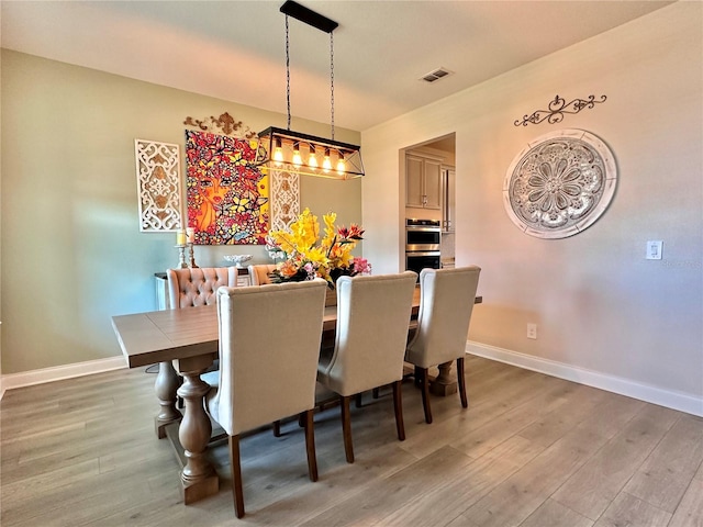 dining room featuring hardwood / wood-style flooring